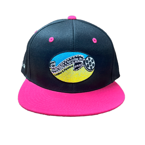 Close-up of SSR® hot pink and black snapback front with Studio Supply & Recycling, Inc. patch